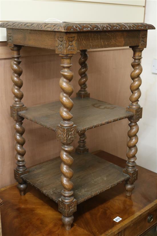 A carved oak three-tier pedestal W.47cm